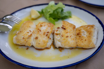 Grilled fillet of white codfish served in fish restaurant in San Sebastian, Basque Country, Spain