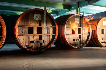 Old and modern equipment for distillation of strong alcoholic apple drink calvados in Normandy, Calvados region, France