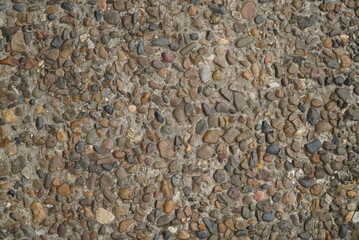 Light grey gravel, Pebble floor texture, top view. Small pebbles in concrete
