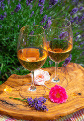 French rose wine from Provence, two glasses of wine with purple lavender flowers on background