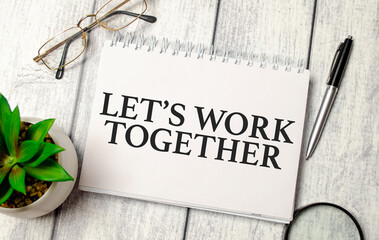 let's work together words on notepad and pen, calculator and glasses
