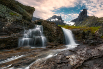 Fototapeta na wymiar A small mountain waterfall, Litlefjellet village, Central Norway