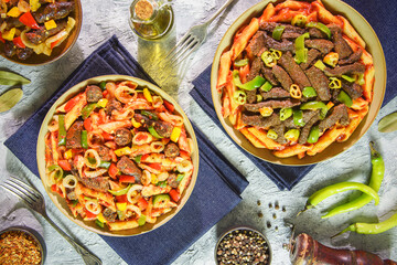 Arabic cuisine; Traditional Egyptian liver and sausage pasta dishes. Top view with close up.