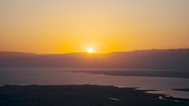Aerial time lapse of seascape during sunrise at Masada