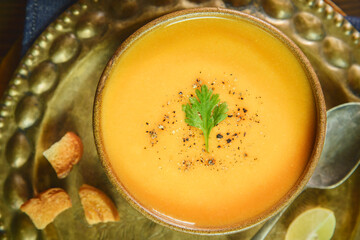 Arabic Cuisine; Middle Eastern traditional red lentil soup served with fresh lemons and crispy croutons. 