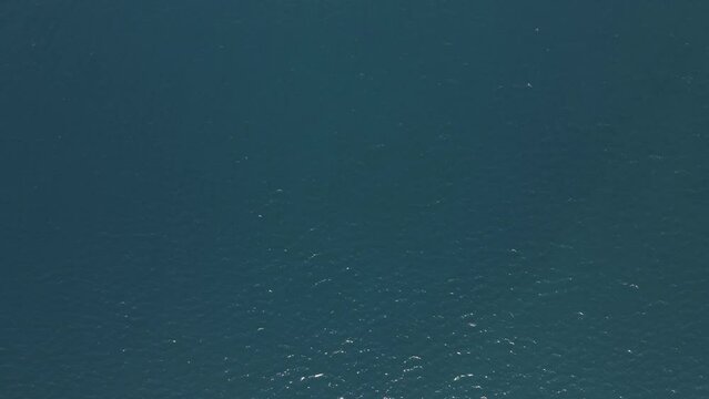 Aerial view of a motorboat along the coast in Marciana Marina, Elba Island, Italy.