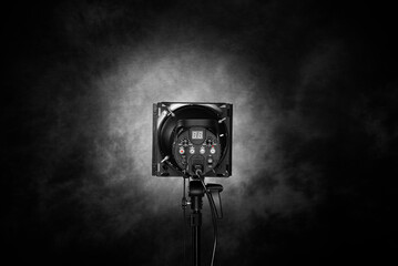 Studio flash on a dark background. Pulse light.