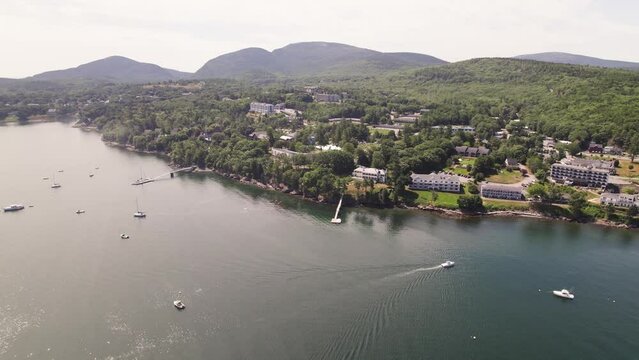 Aerial view of Bar Harbor hotels and resorts on the coast near Acadia National Park, the Atlantic Ocean, and mountains