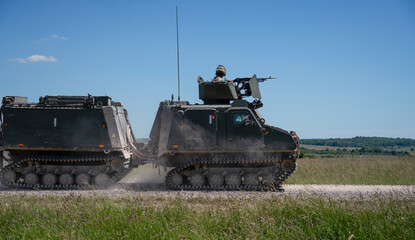 Army all terrain armoured vehicle in action on a military exercise