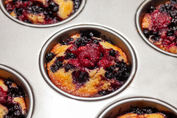 blueberry and raspberry muffin after baking