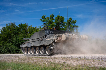 closeup of an army main battle tank in action 