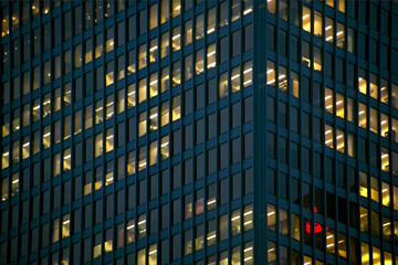 Office tower windows illuminated at night