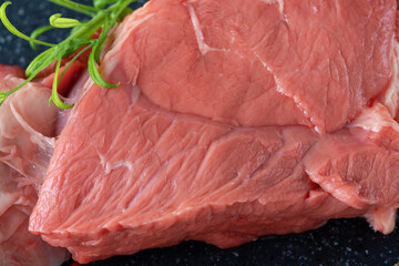 Raw beef meat on dark background
