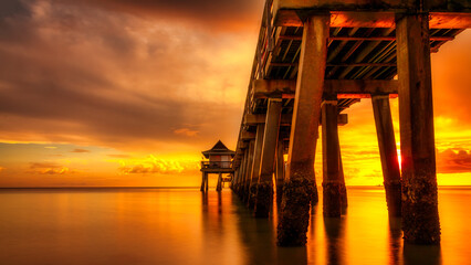 Naples Pier on the beach at sunset in Naples, Florida, USA. Travel concept.