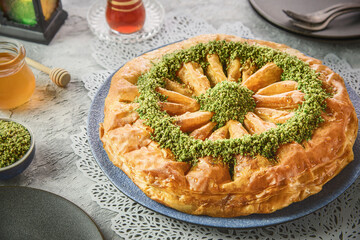 Middle Eastern traditional  dessert "Baklava" or "Baklawa". Served with Arabic tea and honey.