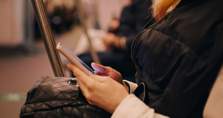 Passenger using technology phone in subway for travel. Means of communication. Lifestyle and...