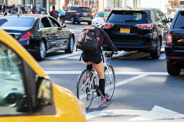 Fototapeta na wymiar traffic scene with cars and cyclist