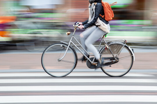 woman rides a bicycle in the city