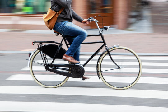 woman rides a bicycle in the city