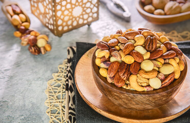 Ramadan celebration. Mix of Crispy salted nuts. Top view with close up. Ramadan background with copy space.
