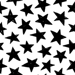 Seamless pattern with black star silhouettes. Seamless abstract pattern with black hand drawn shabby stars on white background. Cosmos texture for paper, wrapping and fabric. Geometric ornament.