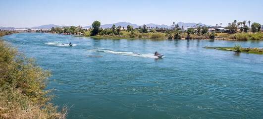 The Colorado River at Blythe, California, looking at the River from the West Bank and People Riding Jet Skis