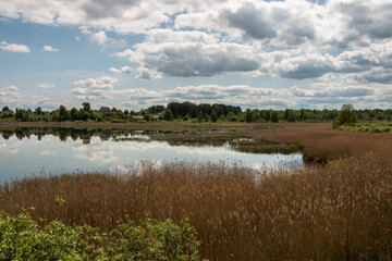 Beautiful rural landscape, lake, sky with clouds. belarus.