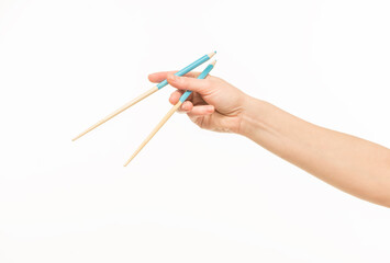 hand holding chopsticks on white background isolated