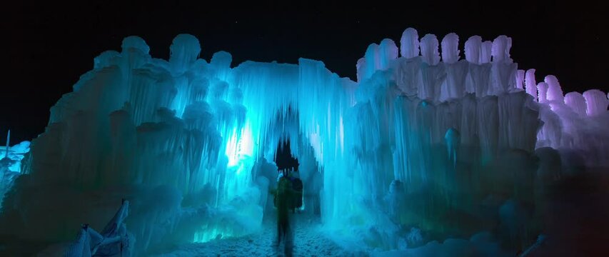 Time Lapse Shot Of People Exploring Illuminated Ice Castles During Vacation - Midway, Utah