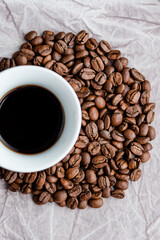 Coffee beans with cup