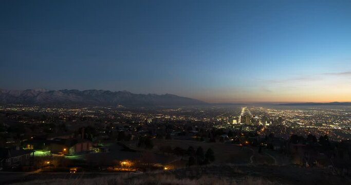 Lockdown Time Lapse Scenic View Of Illuminated City By Mountains During Sunset - Salt Lake City, Utah
