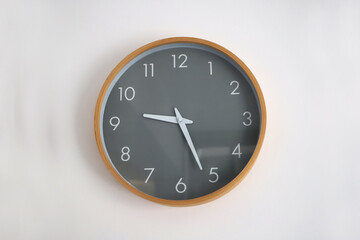 
Minimalist style wall clock. Nordic. Modern design. Wooden clock with needles. Hour. Twenty-five...