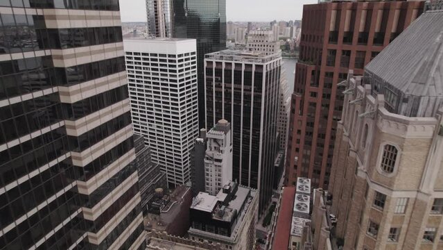 aerial view on buildings, camera moves between buildings, downtown Manhattan, old building of Financial District New York