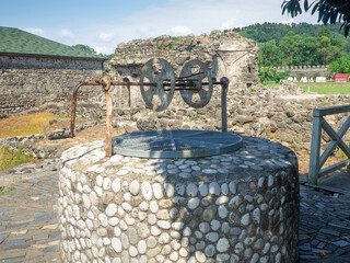 Ruin of an old castle. Remains of civilization. Fortress in Georgia.  Well. Ancient mechanism. City...