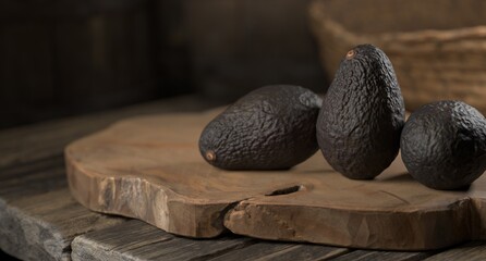 Avocados on a wood against rustic natural background