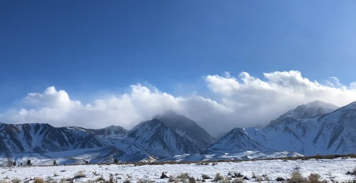 Time lapse of clouds rolling over the Sierra Nevada mountain range in Mammoth Lakes California