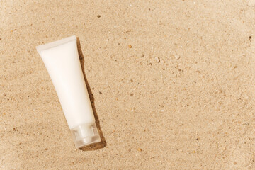 cosmetic bottle mockup on sand