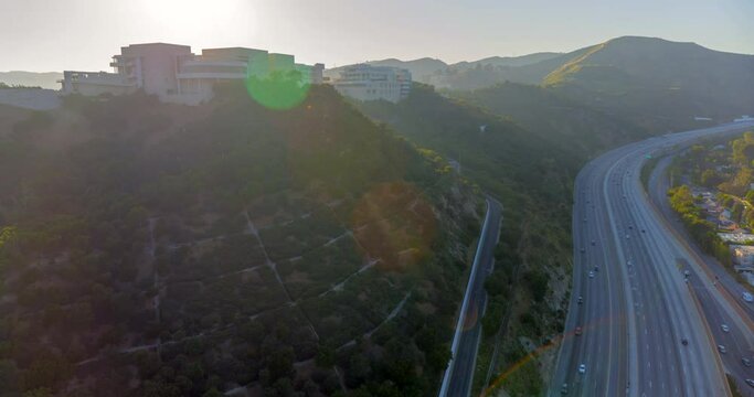 Aerial Moving Over The Massive Getty Research Institute Campus With Light Freeway On The Side Of The Frame - Los Angeles, California