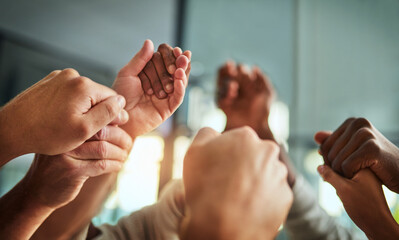 Diverse people holding hands in teamwork, success and support while showing solidarity, trust and...