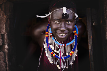 Portrait of Maasai mara man with traditional colorful necklace