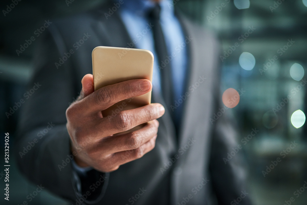 Aufkleber A phone in hand for texting, communication and networking for business planning, discussion and strategy. Closeup of a corporate professional holding a cellphone while standing on a dark background