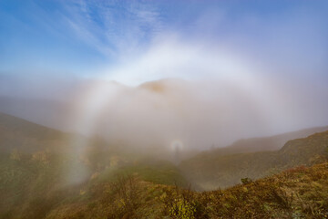 Morning fog above the autumn mountains.