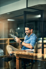 Business tools just keep getting smarter and smarter. Shot of a young businessman using a digital...