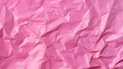 Wrinkled colored paper background texture voluminous pink