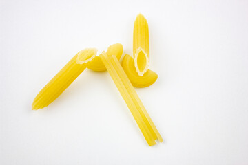 Penne pasta, Fellini. Pasta concept on white background. Piece pasta, choice. Pasta isolated.