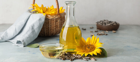 Composition with sunflower oil and seeds on table