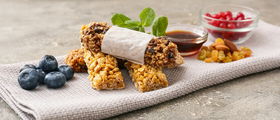 Healthy cereal bars on grunge background
