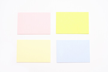 Mock-up of many empty multicolored office stickers on a white background.