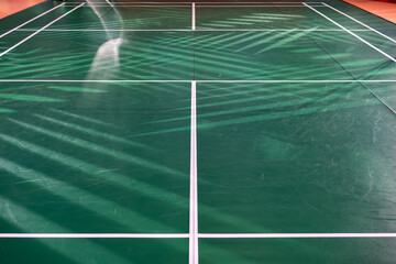 empty green used badminton court background is ready for playing badminton in competition Tournament with spotlight.