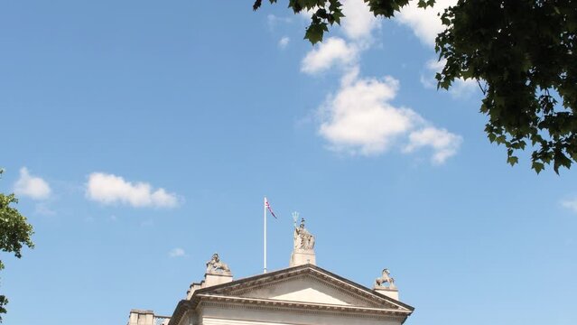LONDON, ENGLAND - June 14, 2022: 4k vertical tilt footage of the facade of the Tate Britain museum on a summer day in Millbank, London, UK concept for English cultural landmarks and art exhibition
